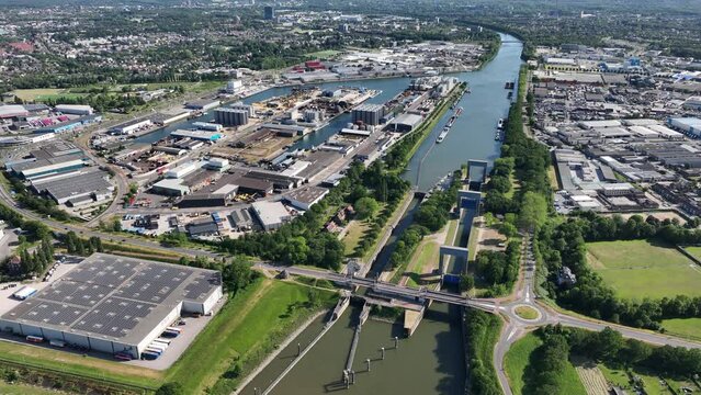 Aerial drone video of the sluice at Nijmegen, The Netherlands and the industrial zone next to it.