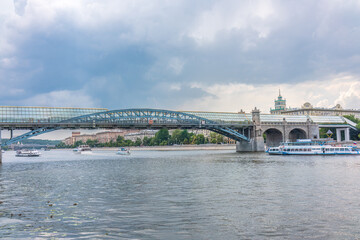 Fototapeta premium View of the Moscow river embakment, Pushkinsky bridge and cruise ships at sunset.