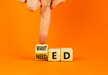 Wanted or needed symbol. Concept words Wanted or needed on wooden cubes. Businessman hand....