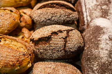 Background of loaves of bread on a bakery showcase.