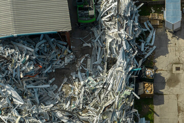 Beg pile of scrap aluminum metal siding from ruined houses after hurricane Ian swept through...