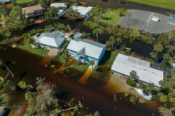 Consequences of natural disaster. Heavy flood with high water surrounding residential houses after...