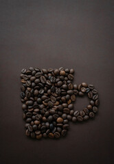 Coffee beans in shape of coffee mug with copy space for text, Creative coffee background