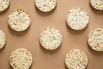 Flat lay rice cake pattern on a natural background, top view.