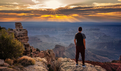 Grand Canyon national Park - North Rim - Person watching an awesome sunrise at Point Imperial 