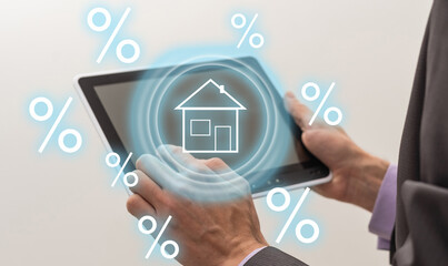 Smart home technology concept. Glowing digital security home lock symbol hologram appearing on smartphone in businessperson's hands. Smarthome safety system automation control app.