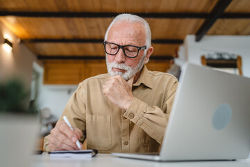 Fototapeta premium One senior caucasian man work on laptop use computer at home