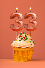Candle number 33 - Cake birthday in coral fusion background