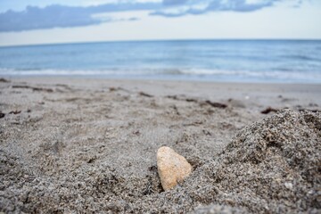 Rock in the sand on beach