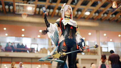 Stunning Anime Girl Fighter Cosplay: Embodying the Grace and Power at Anime Convention - obrazy, fototapety, plakaty