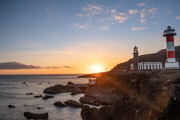 Fototapeta na wymiar Sunset at the salt flats directly on the Atlantic coast. The sea salt shines romantically in the light