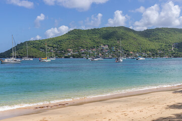 Fototapeta na wymiar Princess Margaret bay with hills in the background, Bequia, Saint Vincent and the Grenadines