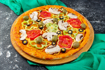 front view mushroom pizza with red tomatoes olives mushrooms all sliced inside on the dark desk pizza dough italian