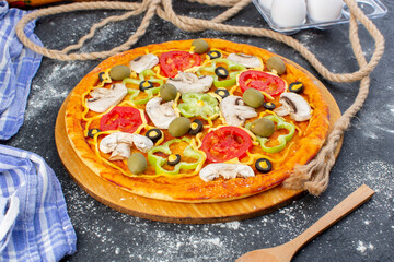 front view vegetable mushroom pizza with tomatoes olives mushrooms with flour on the grey desk pizza dough italian food