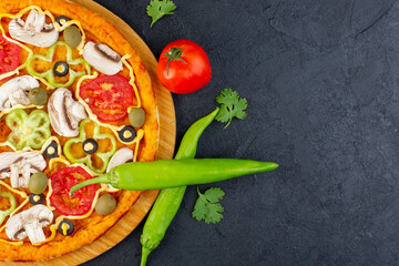 top close view mushroom pizza with red tomatoes bell-peppers olives and mushrooms all sliced inside on the dark background food meal pizza italian