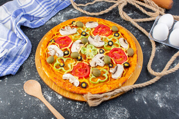 top view mushroom pizza with tomatoes olives mushrooms with eggs on the dark backgorund pizza dough italian