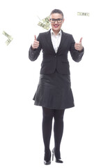 in full growth. happy businesswoman standing among dollar bills.