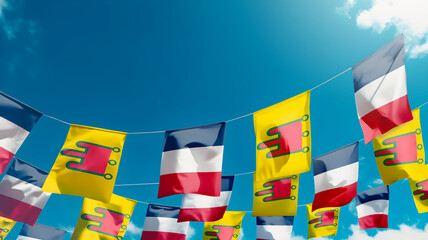 Flag of Auvergne and France against the sky, flags hanging vertically