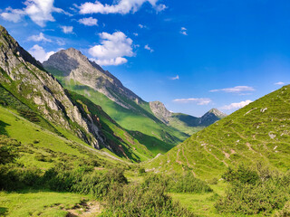 Naklejka premium Meadows and peaks in the trail to El Meicin, Pena Ubina Natural Park, Asturias, Spain