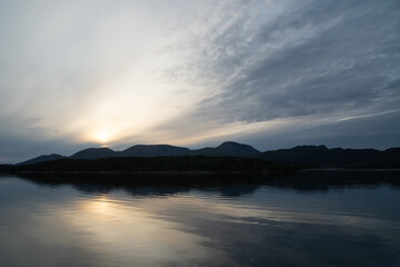 Fototapeta na wymiar When the sun sets over Norway's fjords, the sky lights up in all colors