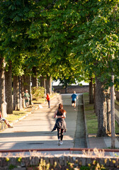 Siena, Italy - 2023, June 24: The Medici fortress walkways. People jogging in a summer afternoon.
