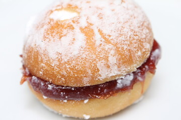 fluffy dough with sugar and guava jam known as a dream. delicious guava dessert. sweet acquaintance in Brazil as a sonho. sonho with selective focus.