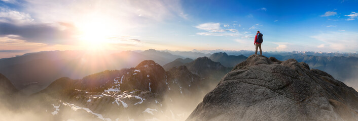 Adventurous Man Standing on top of Mountain Cliff. Extreme Adventure Composite.