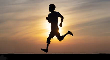 Fototapeta na wymiar shadow of a man with prosthetic legs running