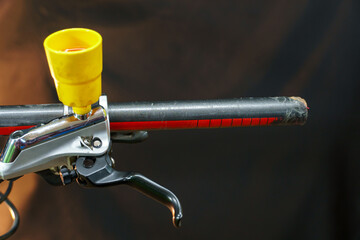 Bleeding the brake system of a mountain bike with a funnel. Bicycle repair. A mountain bike...