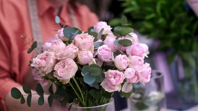 close up lovely bouquet of spring flowers, pink rose blooms thoughtfully designed by skilled florists as gift