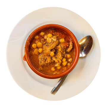 Hearty and satisfying dish callos of tripe simmered in broth with onions, garlic, tomatoes, and spices, added with chopped chorizo and chickpeas. Popular Spanish cuisine. Isolated over white