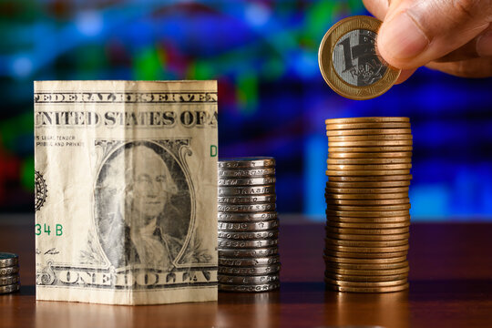 cedula of a US dollar and a Brazilian currency on a financial chart, valuation of the Brazilian currency