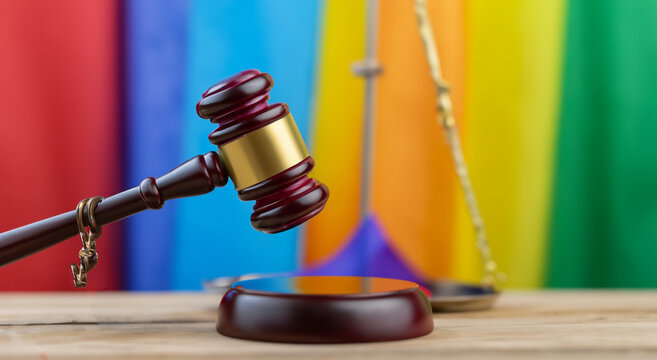 maso of a judge with the lgbt flag in the background
