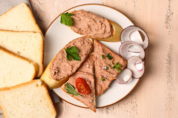 Plate of sandwiches with delicious pate on light wooden background