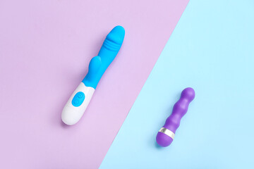 Vibrators from sex shop on color background