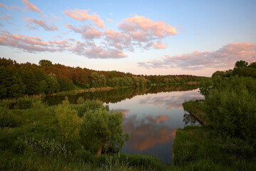 Fototapeta na wymiar summer colorful sunset over the river and ducks in Chernihiv, Ukraine