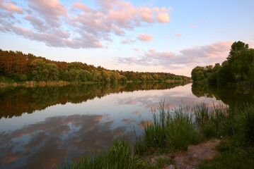 summer colorful sunset over the river and ducks in Chernihiv, Ukraine