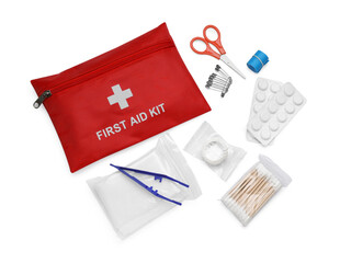 Red first aid kit, scissors, pins, cotton buds, pills, plastic forceps, adhesive plaster and elastic bandage isolated on white, top view