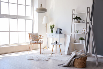 interior of living room with tables, armchair and shelving unit