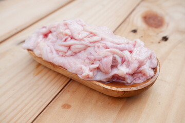 selective focus on piles of chicken skin that are raw and ready to be used as chicken skin oil. soft focus