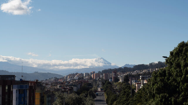 Cotopaxi Volcano and Quito City Skyline with Clouds, Ecuador