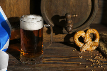 Mug of cold beer on wooden background. Oktoberfest celebration