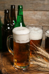 Mug of cold beer on wooden background. Oktoberfest celebration