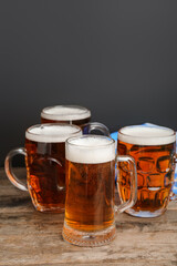 Mugs of cold beer on table. Oktoberfest celebration