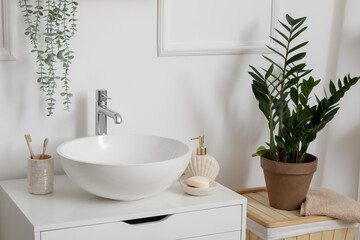 Fototapeta na wymiar Sink bowl, bath accessories and houseplant in interior of bathroom