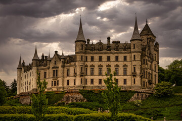 2023-06-05 BACK OF THE DUNROBIN CASTLE IN SUTHERLAND SCOTLAND WITH DARK STORM CLOUDS MOVING IN