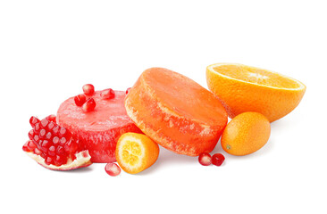 Colorful solid shampoo bars with orange, kumquat and pomegranate on white background
