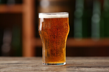 Glass of beer on table in bar. Oktoberfest celebration