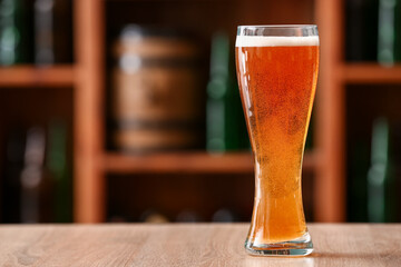 Glass of beer on table in bar. Oktoberfest celebration