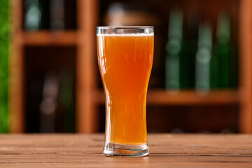 Glass of beer on table in bar. Oktoberfest celebration